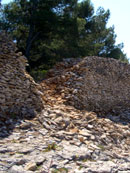 Wall built of rocks along a Supetar beach in Brac