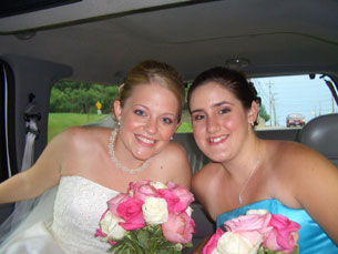 Jenny and new sister Carlye smiling in the limo