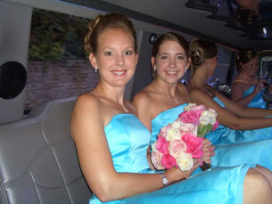 Julie and Kelly smiling in the limo before the wedding