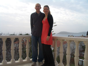 Kelly and Jay posing for a Christmas Eve photo from our balcony