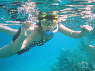 Mom Klocke smiling for the camera while snorkeling in the Red Sea