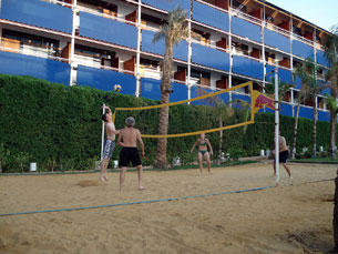 Kevin and Dad Klocke vs. Kelly and Jay in sand volleyball -- our first volleyball since our week home in July!!
