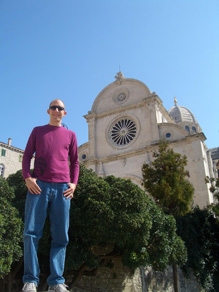 Jay standing on a rock in front of Sibenik's Cathedral