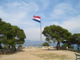Flag atop Marjan Hill whipping in the wind