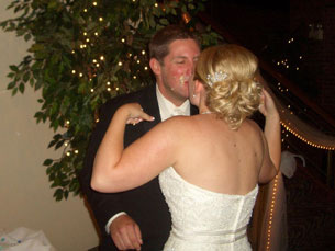 Jenny and Chad sharing a kiss after smashing cake in each other's face