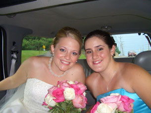 Jenny and new sister Carlye smiling in the limo