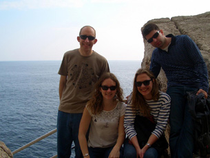 Jay, Kelly, Milda, Mario by a cafe along the rocks outside the walls